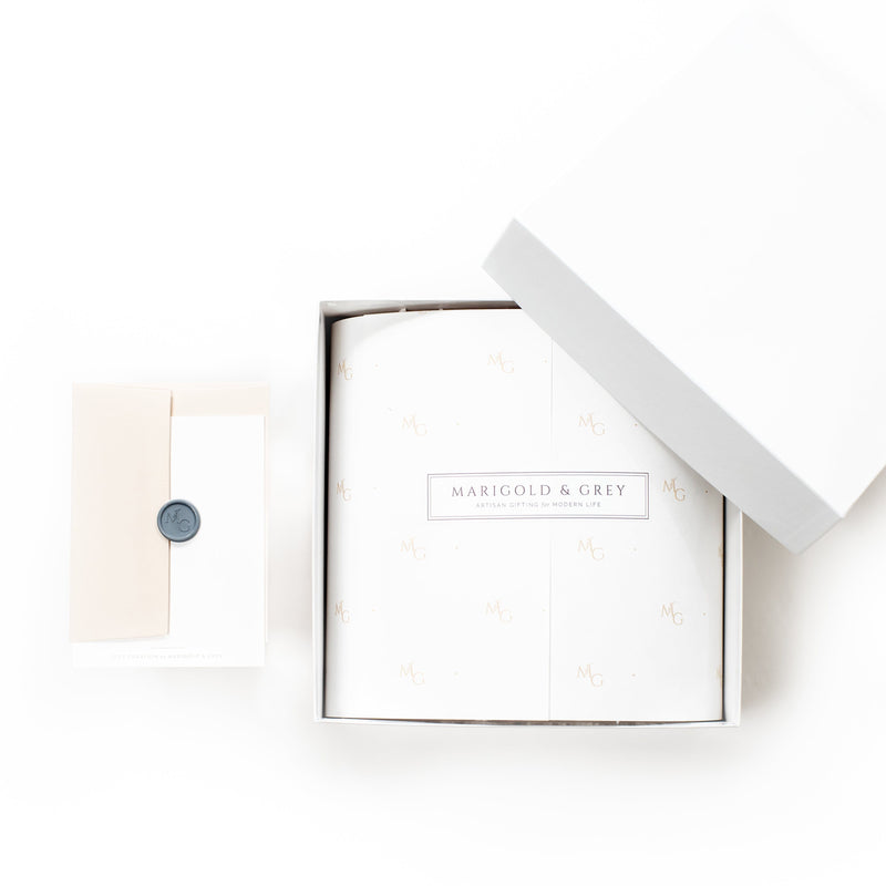 Shop "Refined Bride," the signature engagement gift box by Marigold & Grey. 
