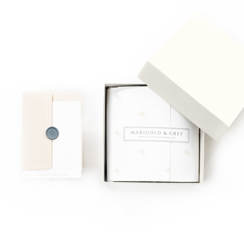 Product packaging with 'Marigold & Grey' branding on a white background