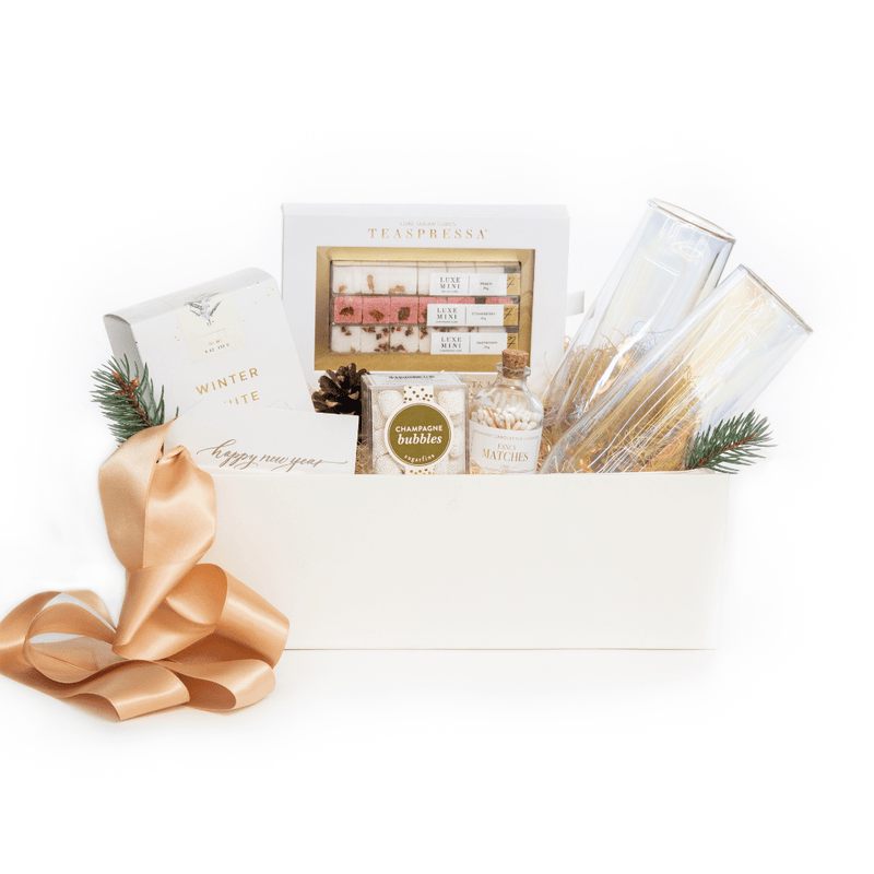 If you can’t pop bottles in person, send them our signature New Years Eve gift box, 'Cheers to a New Year' by M&G. 100% woman-owned and led. Free U.S. shipping.