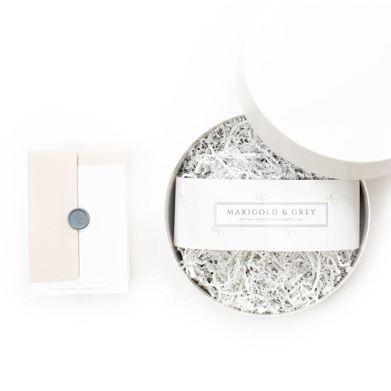 Shop "Mom-to-Be", the signature unisex baby gift box by Marigold & Grey that makes the perfect gender neutral gift for new moms.