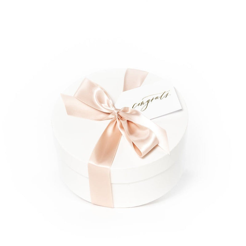 Shop "Mom-to-Be", the signature pregnancy announcement gift box by Marigold & Grey.